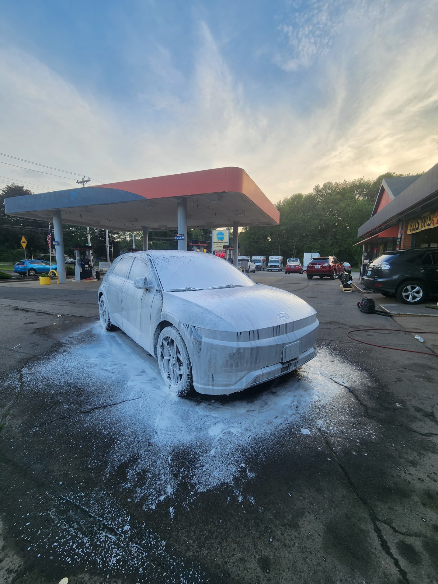 Hyundai Ioniq 5 foam wash at sunrise