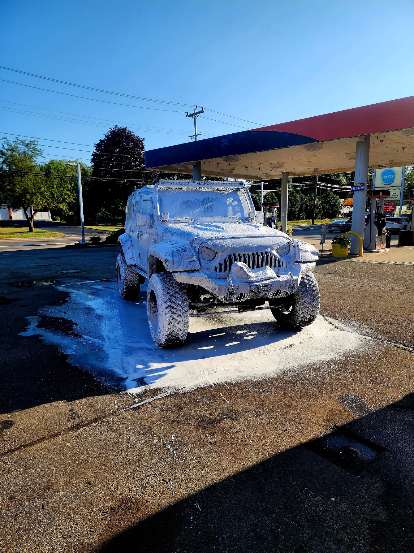 Lifted Jeep Wrangler foam wash