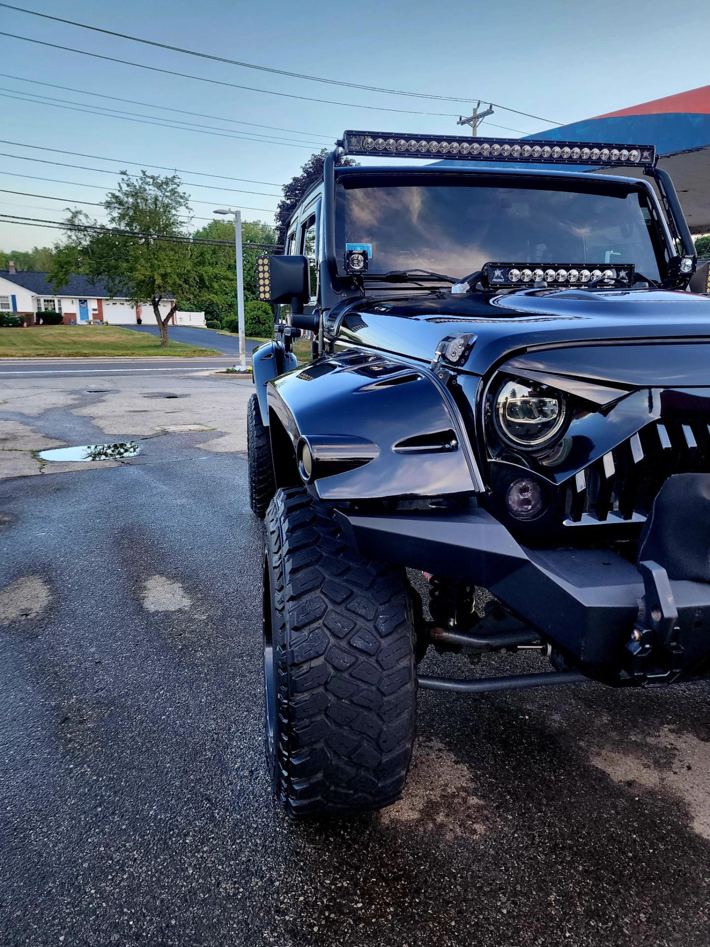 Blacked-out lifted Jeep Wrangler with light bar